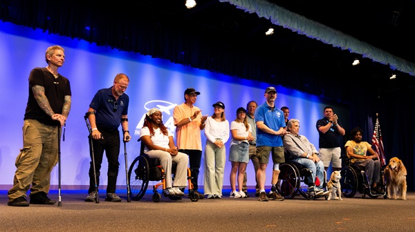 Able Flight pilots Ronny Ahmed of Florida, Ryan Berndt of Wisconsin, Brandi Fields of Missouri, Chris Karadjov of California, and Domenico "Nick" Lazzaro of Pennsylvania overcame obstacles such as spinal cord injuries, gun violence injuries, cancer, and amputation to earn their certificates, achievements celebrated July 22 at EAA AirVenture Oshkosh. Photo by Jake Teague.