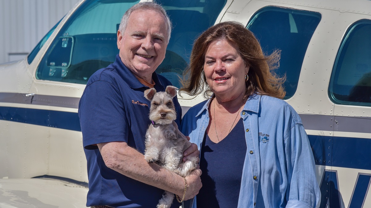Ron and Barbara Timmermans with their dog, Ziva. Photo courtesy of the Florida Aviation Network.