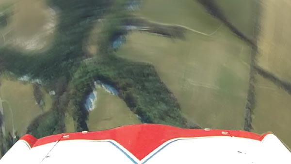 airplane in full spin looking at the ground