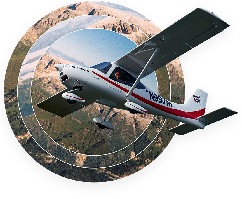 A lightsport aircraft flying above beautiful terrain.